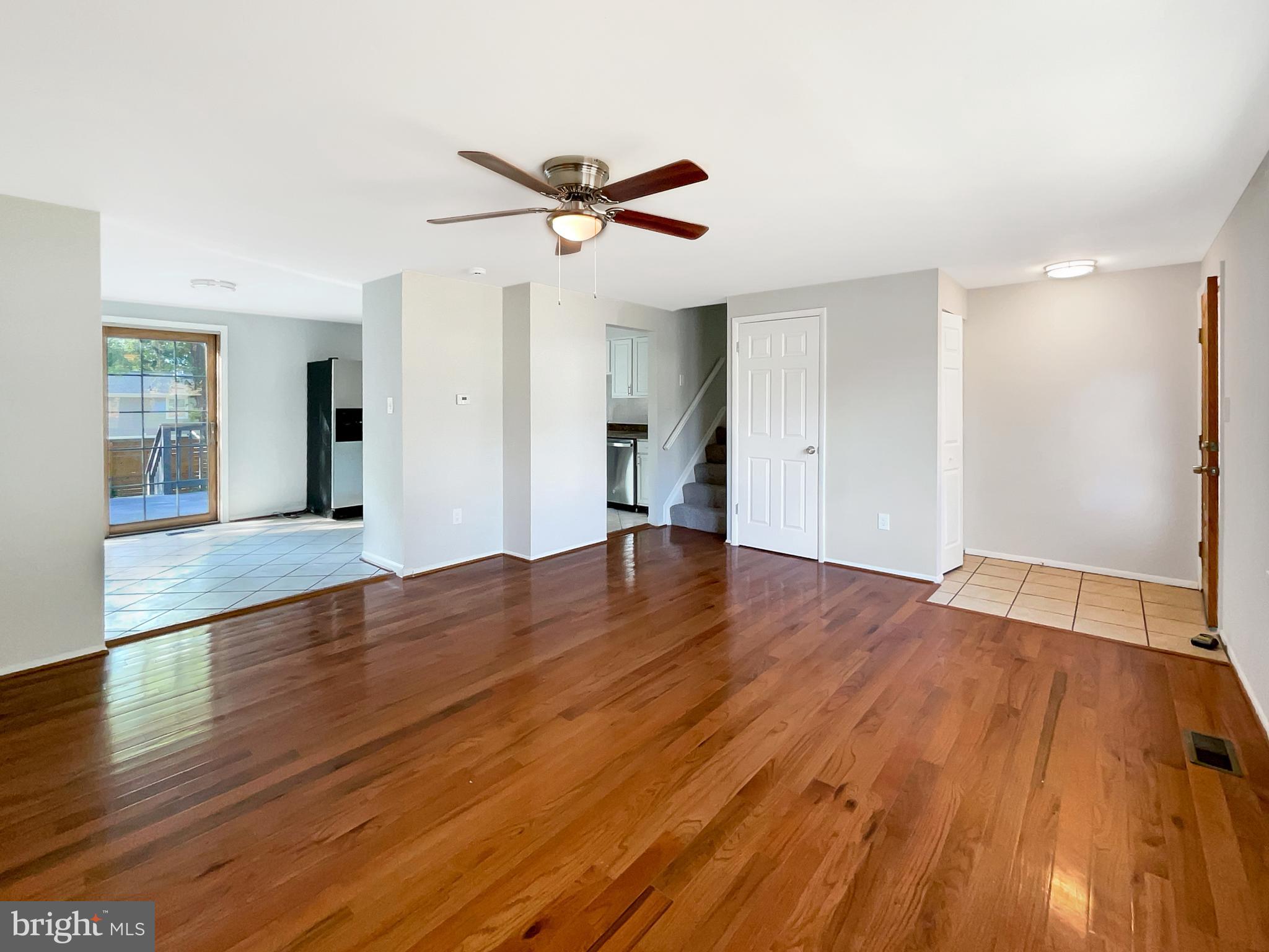 113 North Harrison Road Sterling, VA 20164 - Photo 11 of 19 a view of empty room with wooden floor and ceiling fan