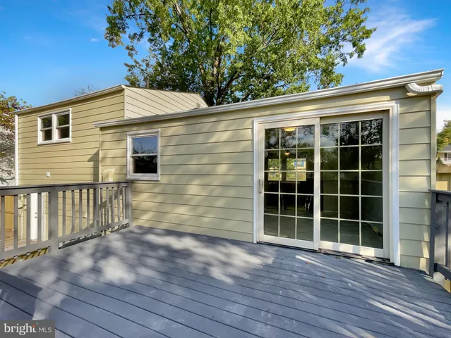 a view of front door and deck of the house