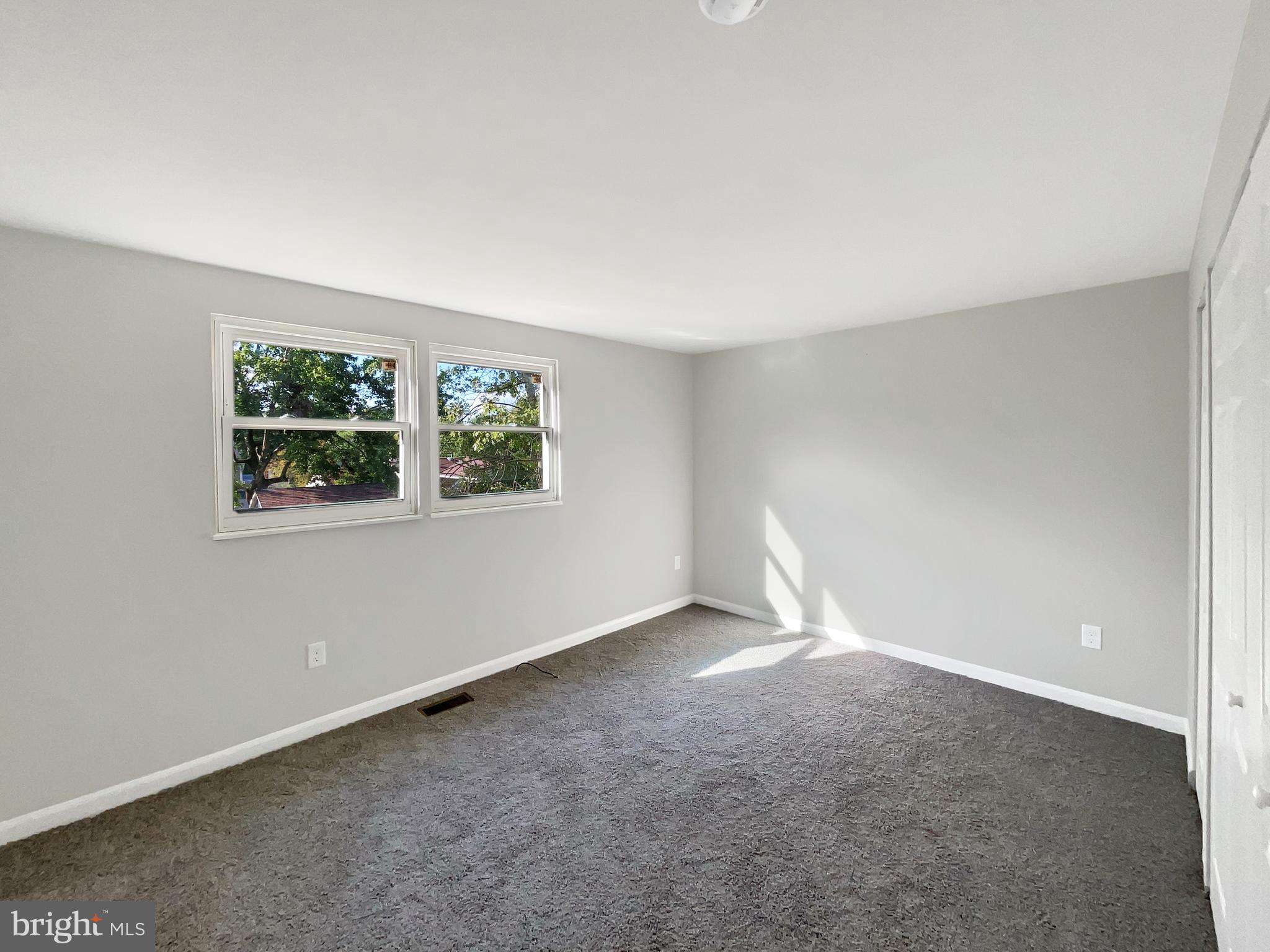 113 North Harrison Road Sterling, VA 20164 - Photo 5 of 19 a view of an empty room with windows