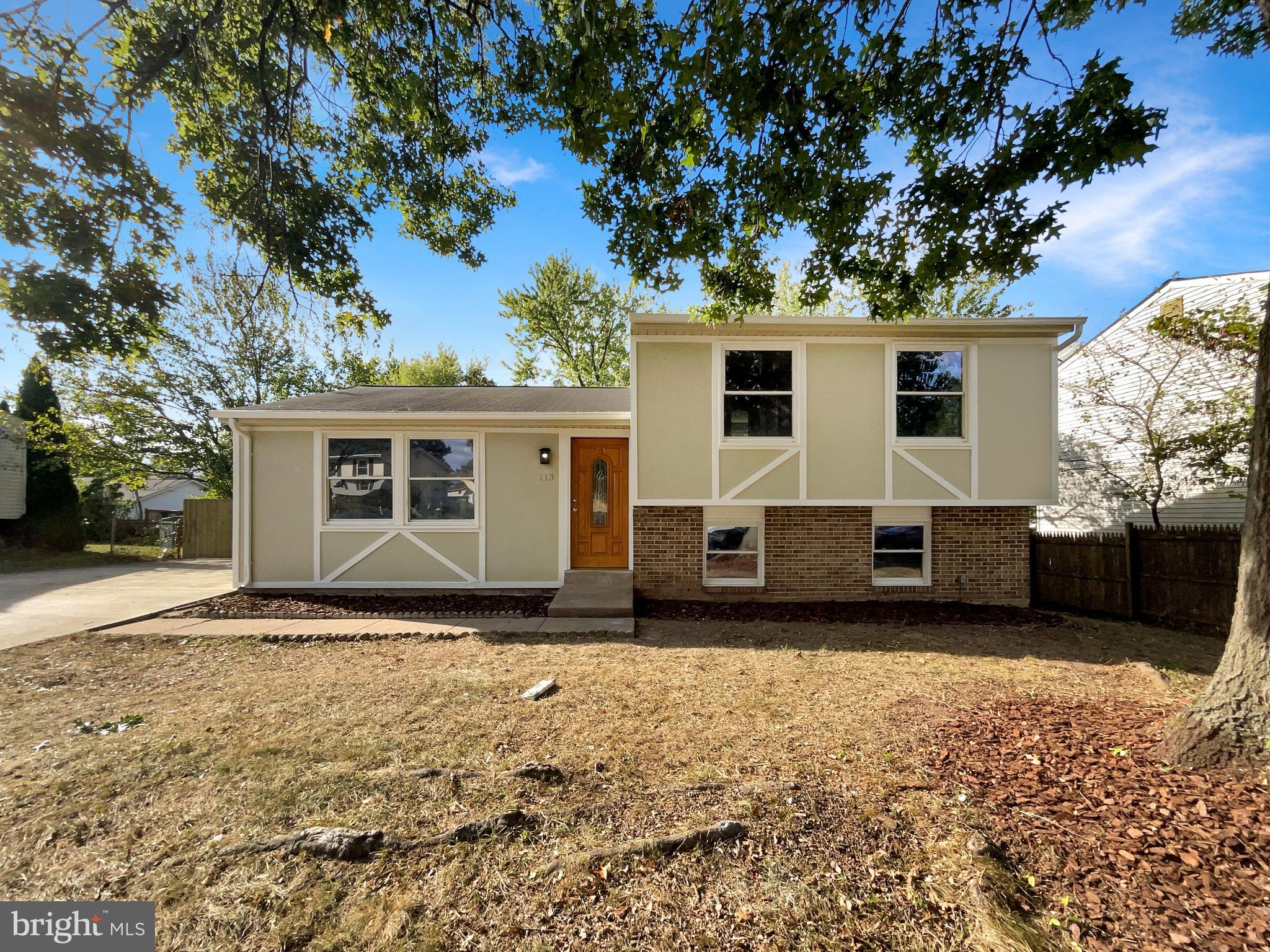 113 North Harrison Road Sterling, VA 20164 - Photo 9 of 19 a house with trees in the background