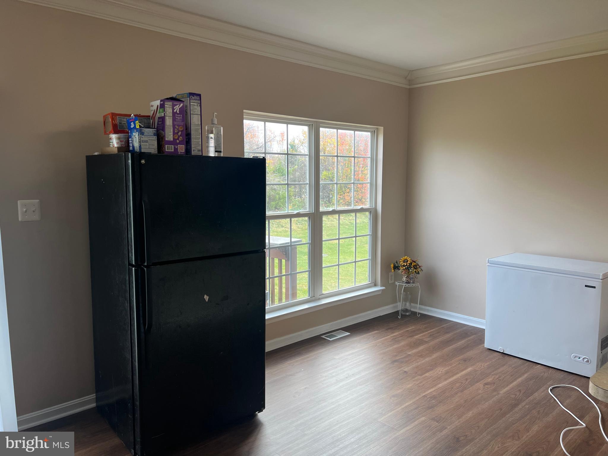 442 Sequoia Drive Smyrna, DE 19977 - Photo 5 of 15 a view of a kitchen with wooden floor and a window