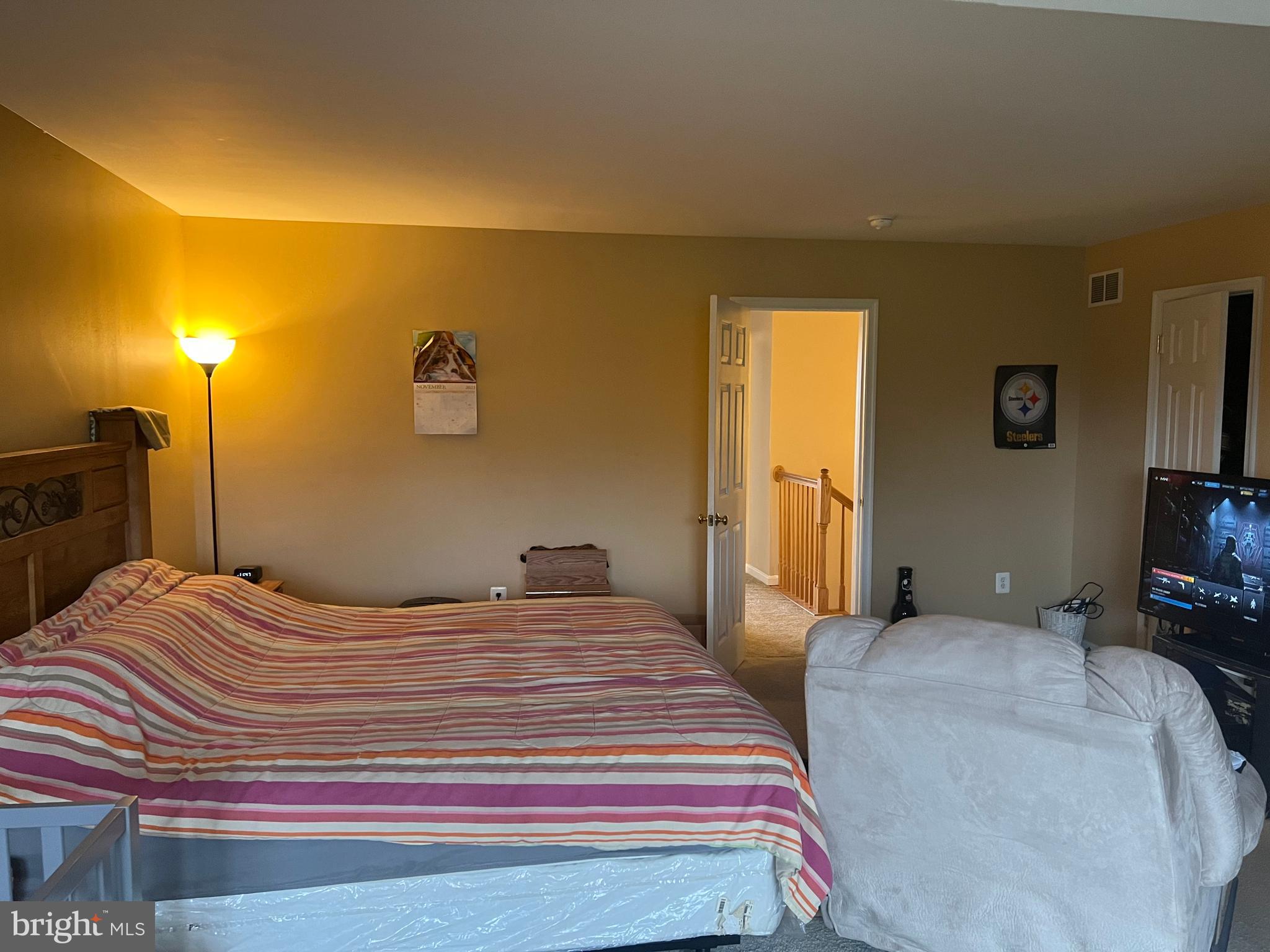 442 Sequoia Drive Smyrna, DE 19977 - Photo 7 of 15 a bedroom with a bed and a flat screen tv