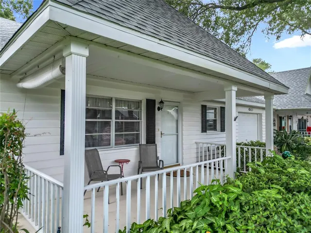 a view of a house with a small yard