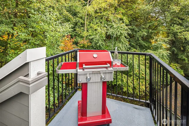 a view of balcony with wooden floor and fence