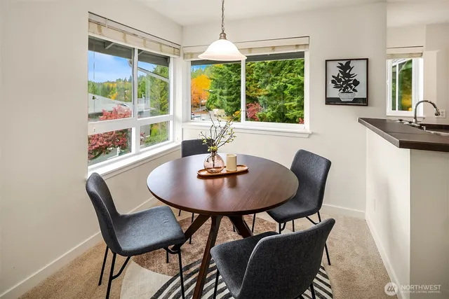 a view of a dining room with furniture window and outside view