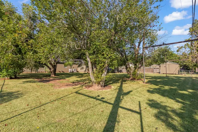 a view of yard with swimming pool