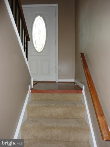 19029 Staleybridge Road Germantown, MD 20876 - Photo 22 of 28 a view of an entryway with wooden floor