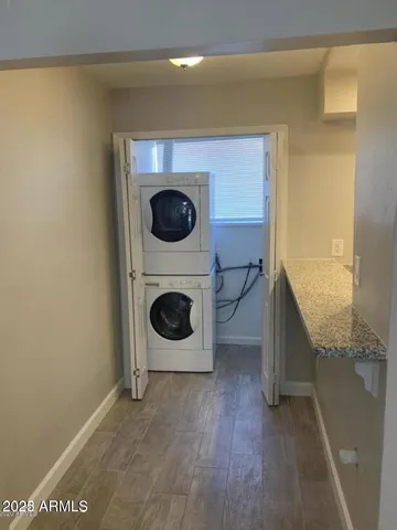 a view of a hallway with washer and dryer