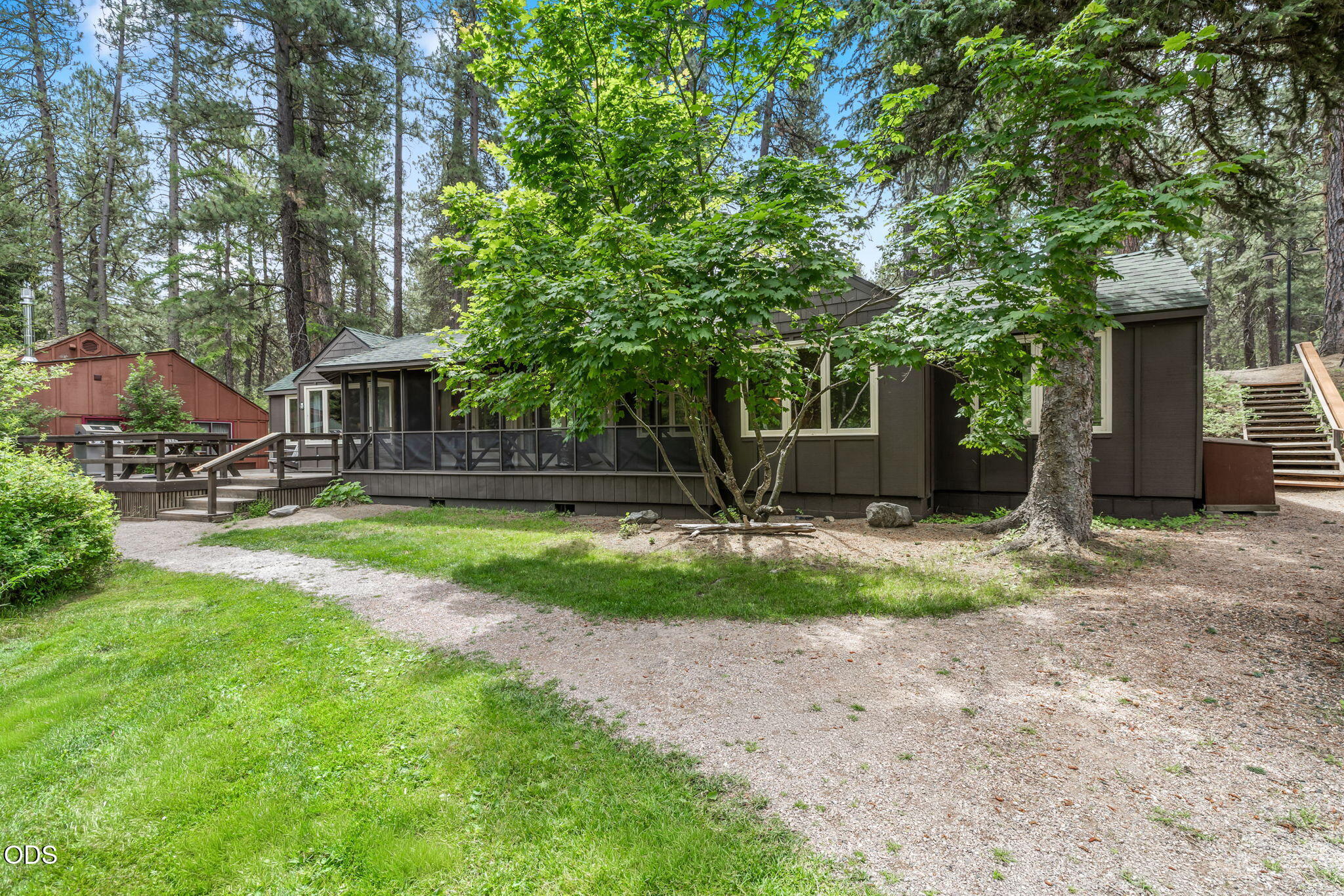 13375 Southwest Forest Service Road, Unit 3 U1 Camp Sherman, OR 97730 - Photo 3 of 29 a view of a house with backyard and a tree