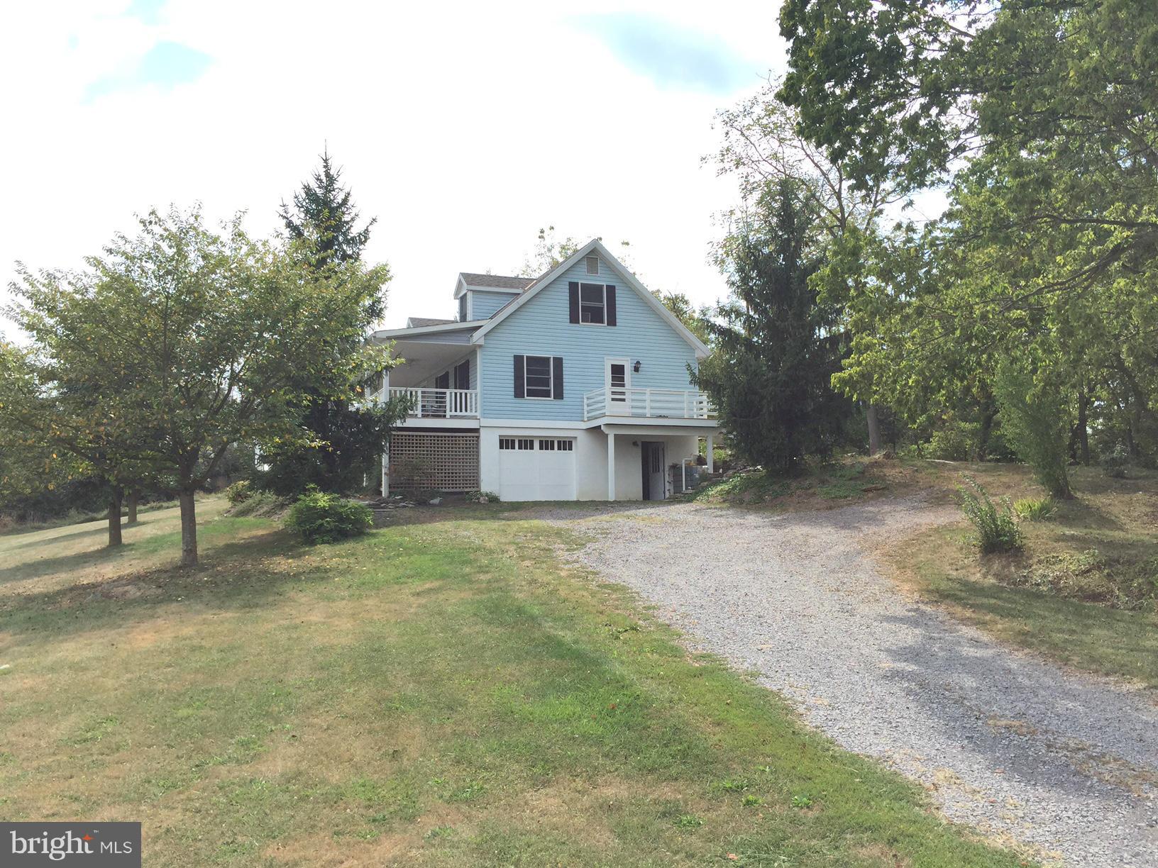 539 Turner Road Shepherdstown, WV 25443 - Photo 3 of 29 a front view of a house with a garden