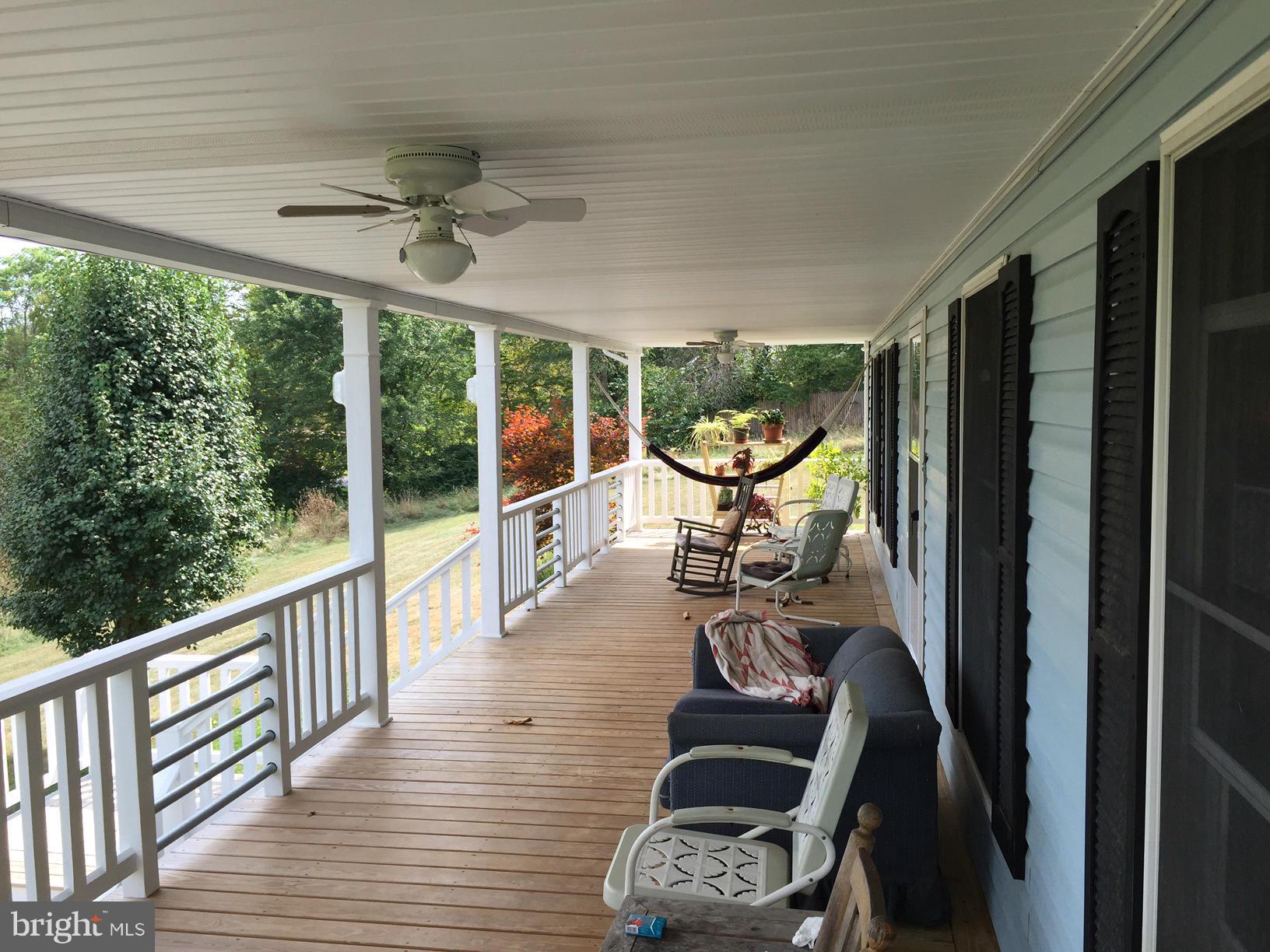539 Turner Road Shepherdstown, WV 25443 - Photo 7 of 29 a view of a balcony with chair and wooden floor