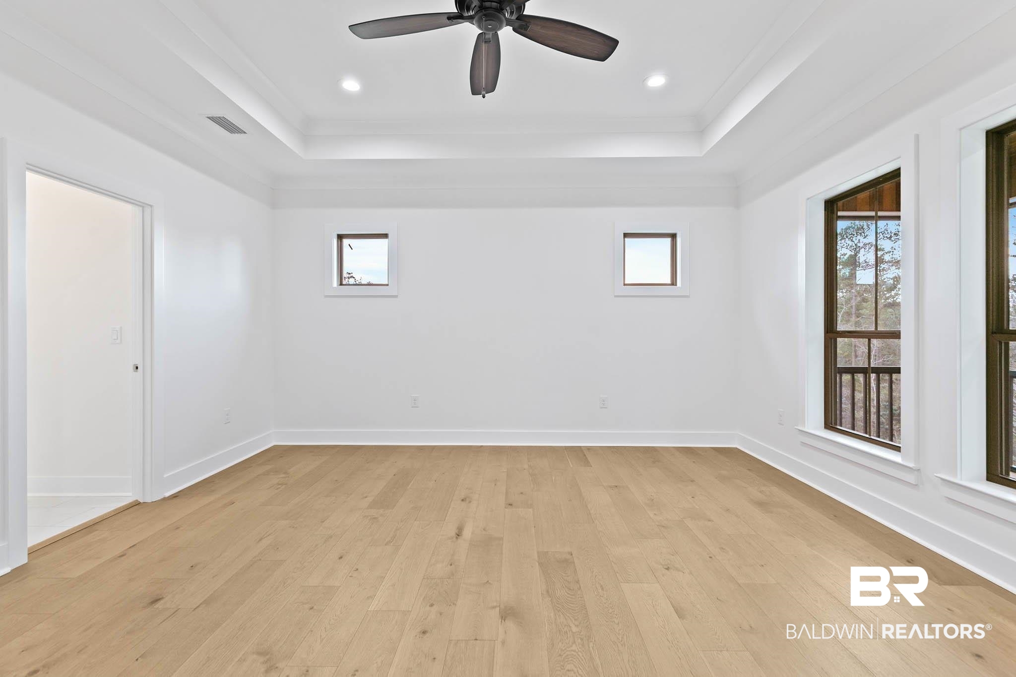 6656 Garrison Drive Daphne, AL 36527 - Photo 26 of 57 Spare room featuring light wood finished floors, ceiling fan, a tray ceiling, recessed lighting, and crown molding
