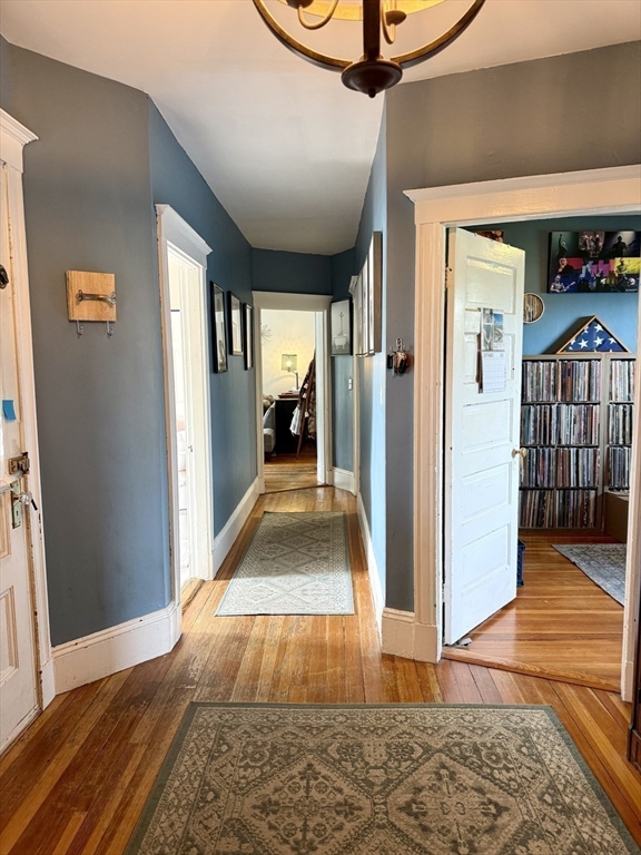 26 Forrest Street, Unit 3 Winthrop, MA 02152 - Photo 13 of 21 a view of a hallway view with wooden floor and staircase