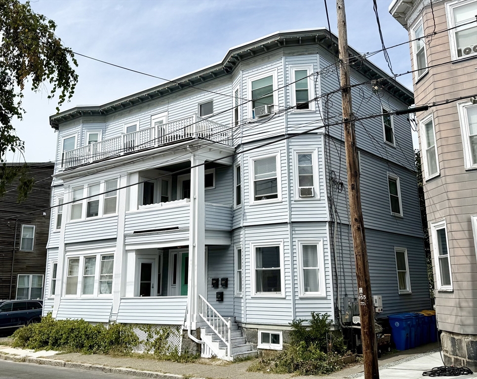 26 Forrest Street, Unit 3 Winthrop, MA 02152 - Photo 18 of 21 a front view of a house with a yard