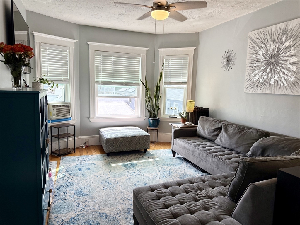 26 Forrest Street, Unit 3 Winthrop, MA 02152 - Photo 3 of 21 a living room with furniture and a window