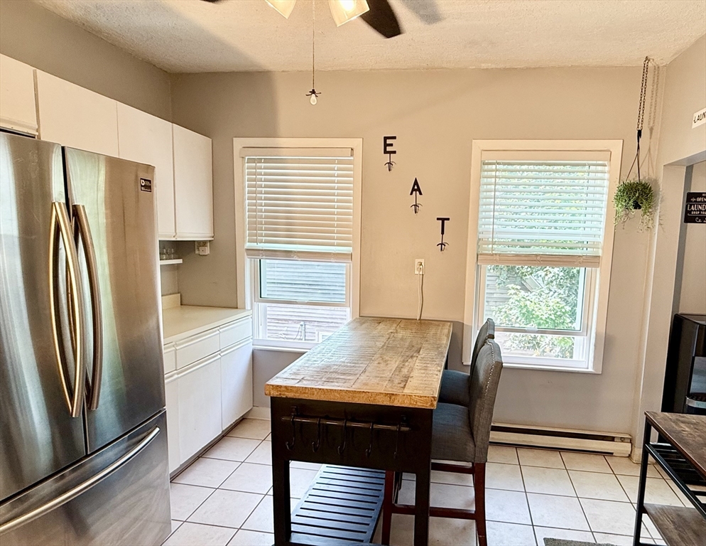 26 Forrest Street, Unit 3 Winthrop, MA 02152 - Photo 4 of 21 a view of a dining room with furniture window and outside view