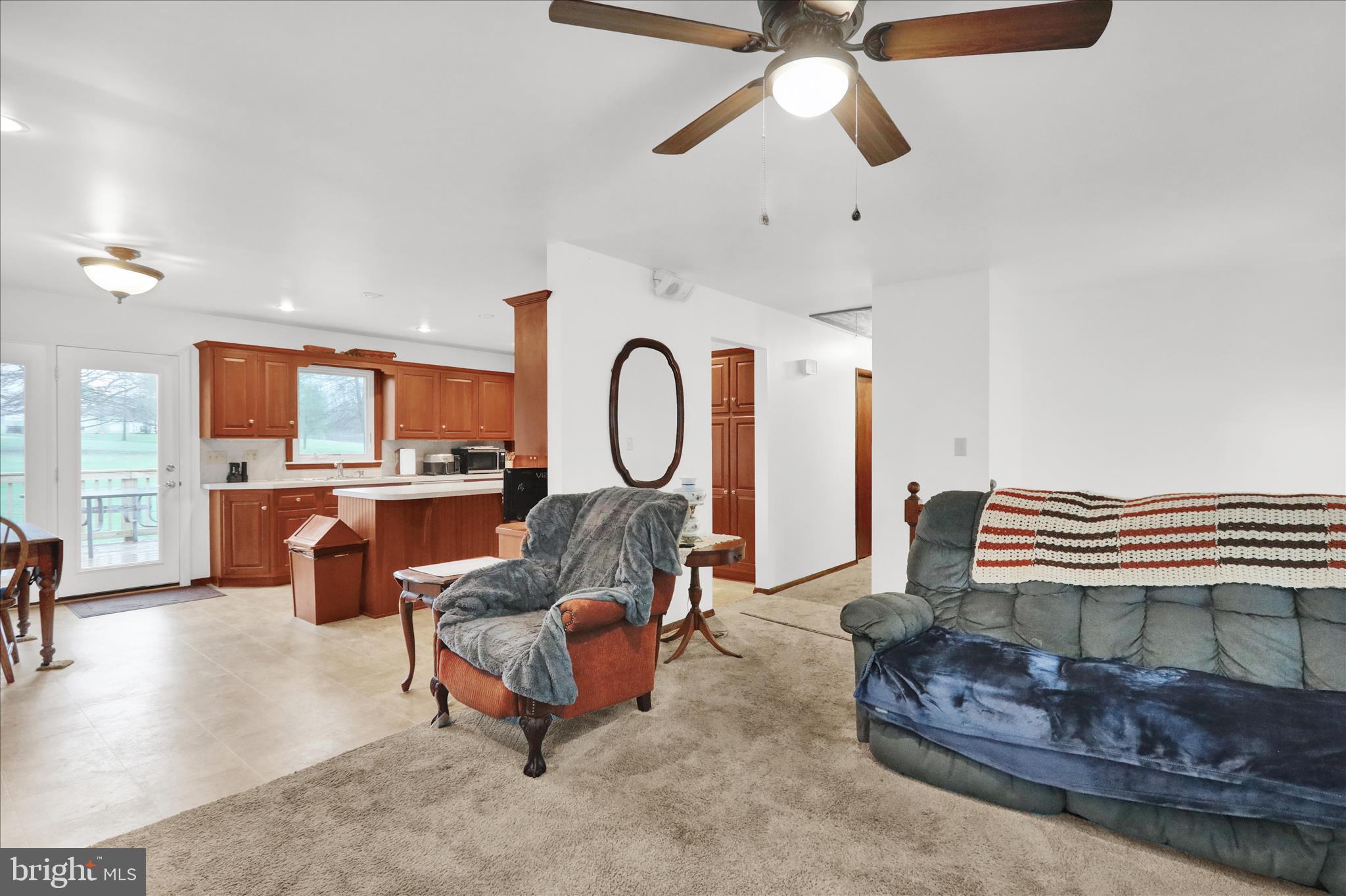 16 Mt Wilson Road Lebanon, PA 17042 - Photo 16 of 30 a living room with furniture kitchen view and a chandelier