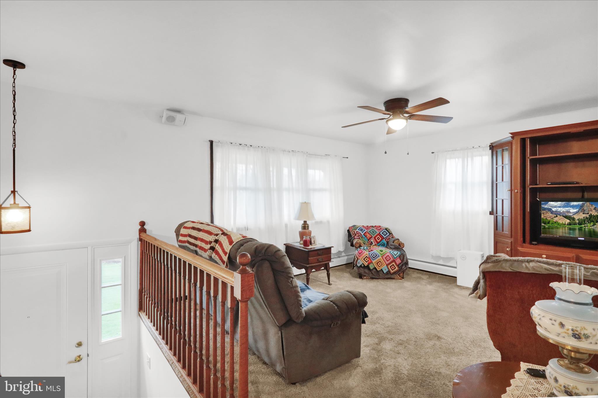 16 Mt Wilson Road Lebanon, PA 17042 - Photo 17 of 30 a living room with furniture stairs and a window