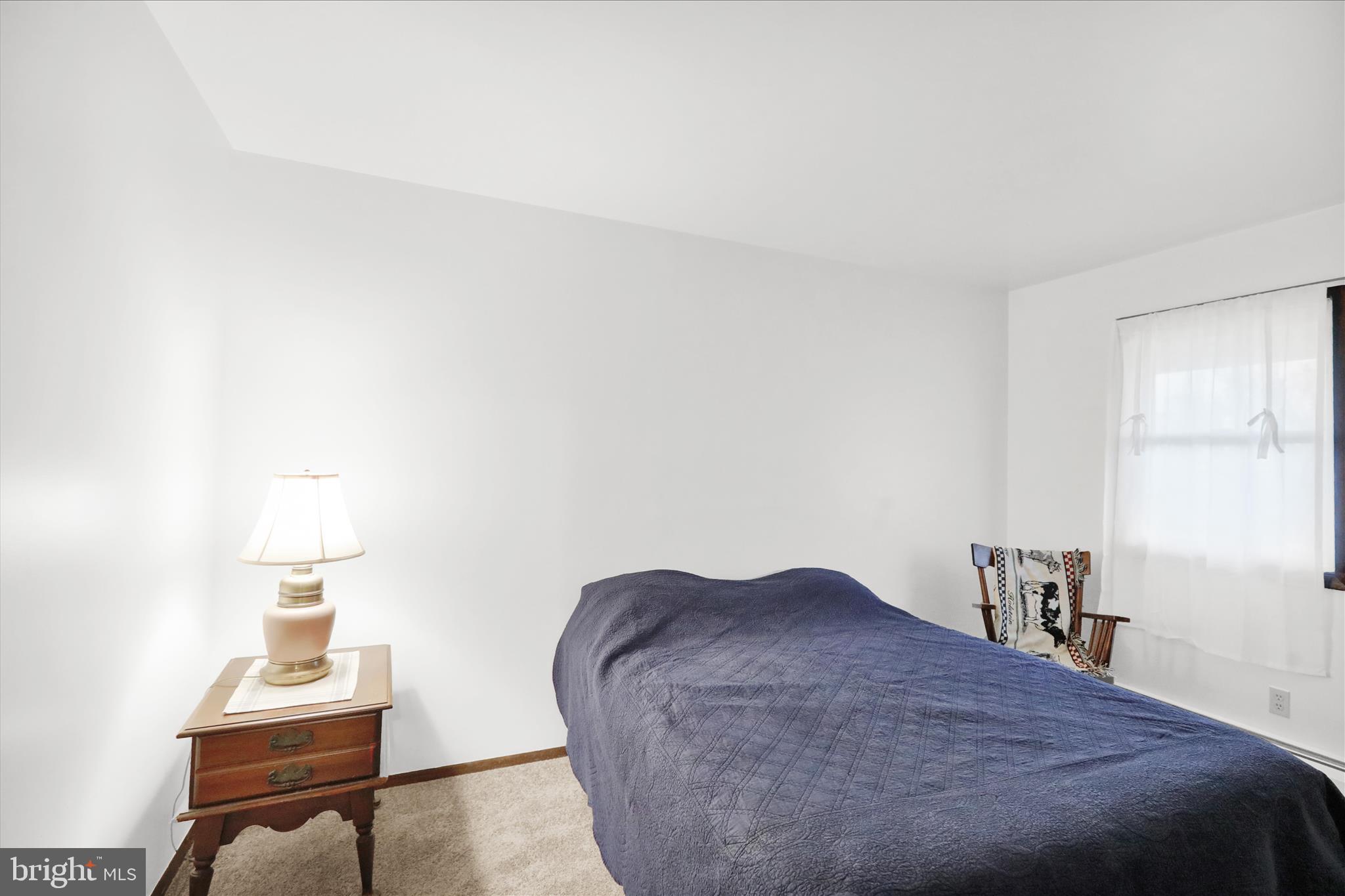 16 Mt Wilson Road Lebanon, PA 17042 - Photo 22 of 30 a bedroom with a bed and a lamp on table