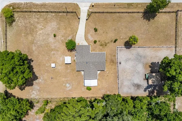 an aerial view of a house with a garden