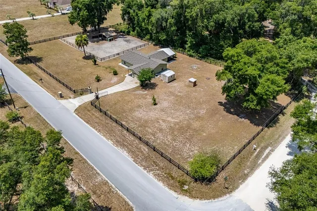 a view of a kitchen with a refrigerator and a sink