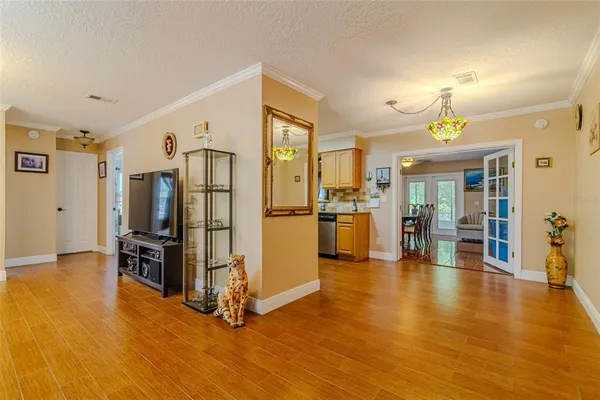 a kitchen with stainless steel appliances granite countertop a refrigerator stove and sink