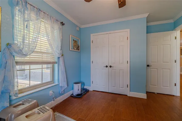 a bathroom with a granite countertop toilet sink and mirror