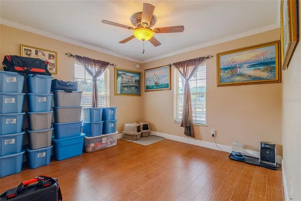 a view of a hallway with wooden floor and closet