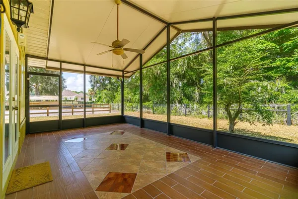 a view of a porch with a floor to ceiling windows