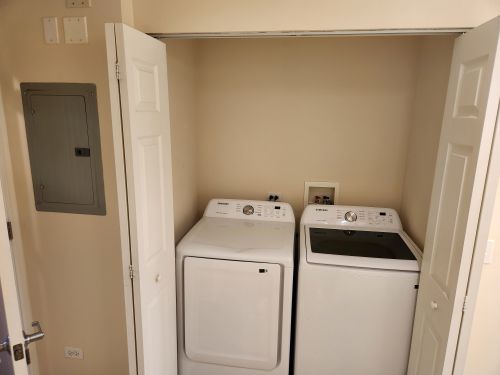 8440 Callie Avenue, Unit 410 Morton Grove, IL 60053 - Photo 22 of 27 a utility room with dryer and washer