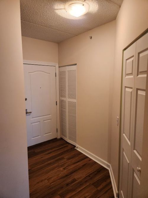 8440 Callie Avenue, Unit 410 Morton Grove, IL 60053 - Photo 6 of 27 a view of a room with wooden floor