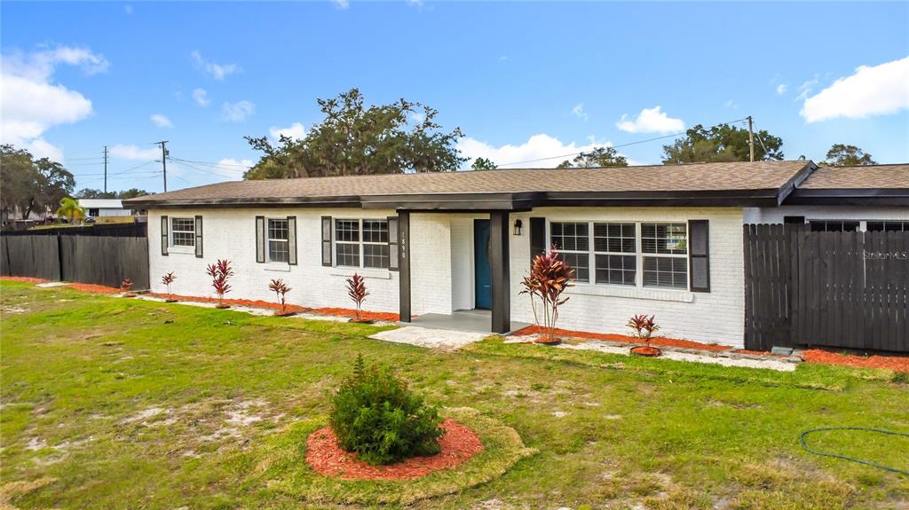1890 Tyner Road Haines City, FL 33844 - Photo 1 of 48 a front view of house with yard outdoor seating and barbeque oven