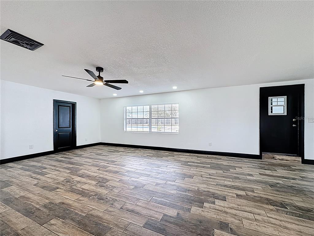 1890 Tyner Road Haines City, FL 33844 - Photo 21 of 48 a view of an empty room with window and ceiling fan