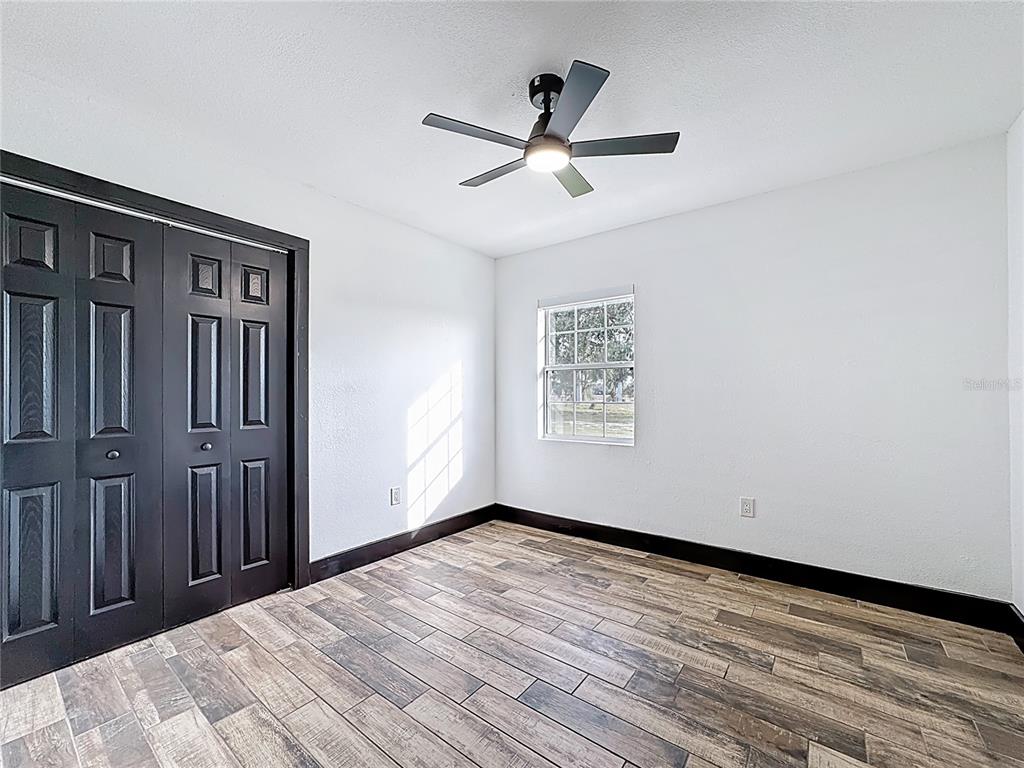 1890 Tyner Road Haines City, FL 33844 - Photo 27 of 48 wooden floor in an empty room