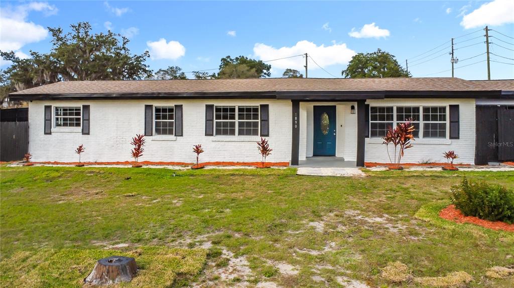 1890 Tyner Road Haines City, FL 33844 - Photo 3 of 48 a view of a house with backyard and garden