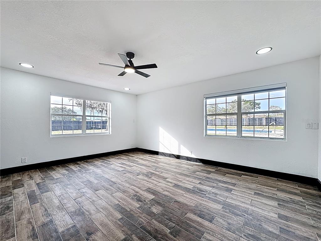 1890 Tyner Road Haines City, FL 33844 - Photo 34 of 48 wooden floor in an empty room with a window