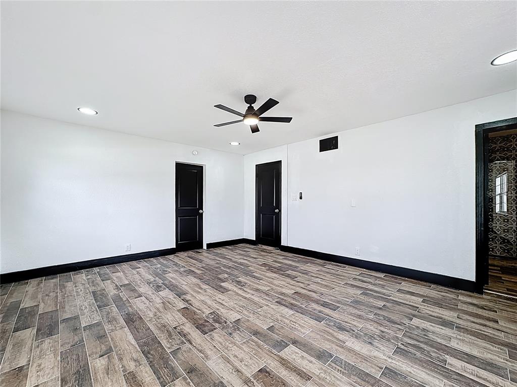 1890 Tyner Road Haines City, FL 33844 - Photo 36 of 48 wooden floor in an empty room with a window