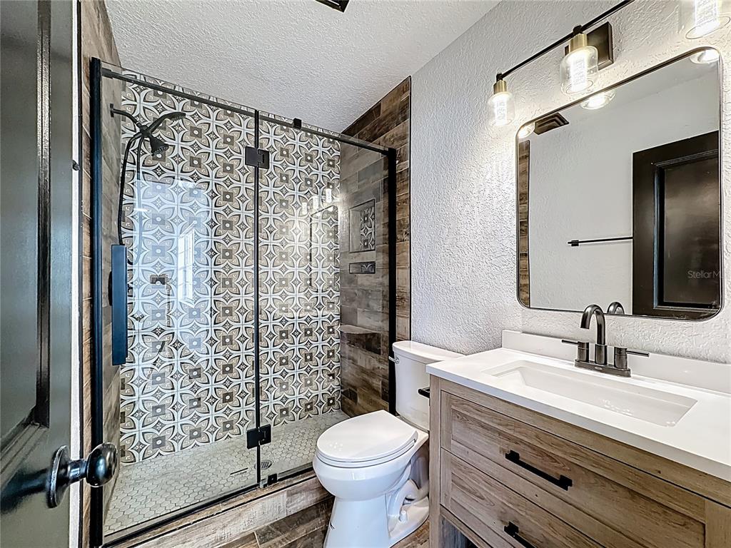 1890 Tyner Road Haines City, FL 33844 - Photo 37 of 48 a bathroom with a sink toilet and shower