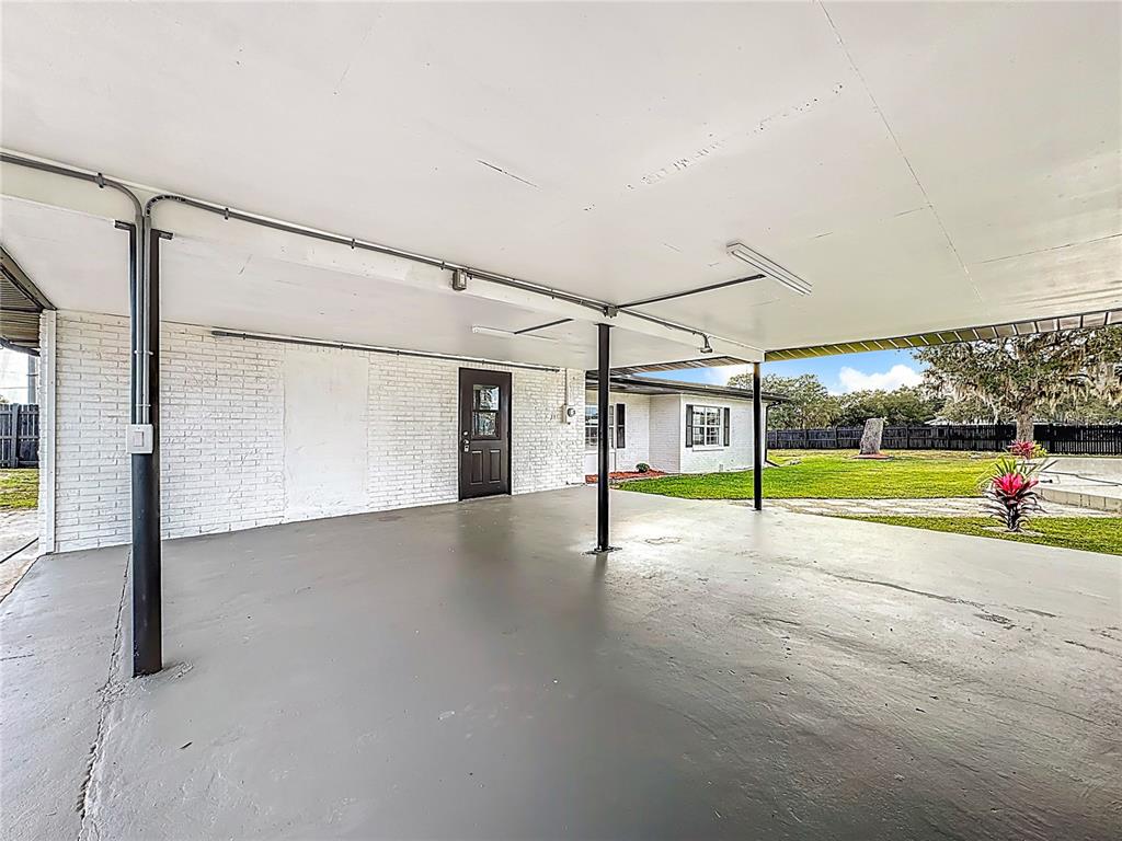 1890 Tyner Road Haines City, FL 33844 - Photo 41 of 48 a view of a house with a yard and table and chairs