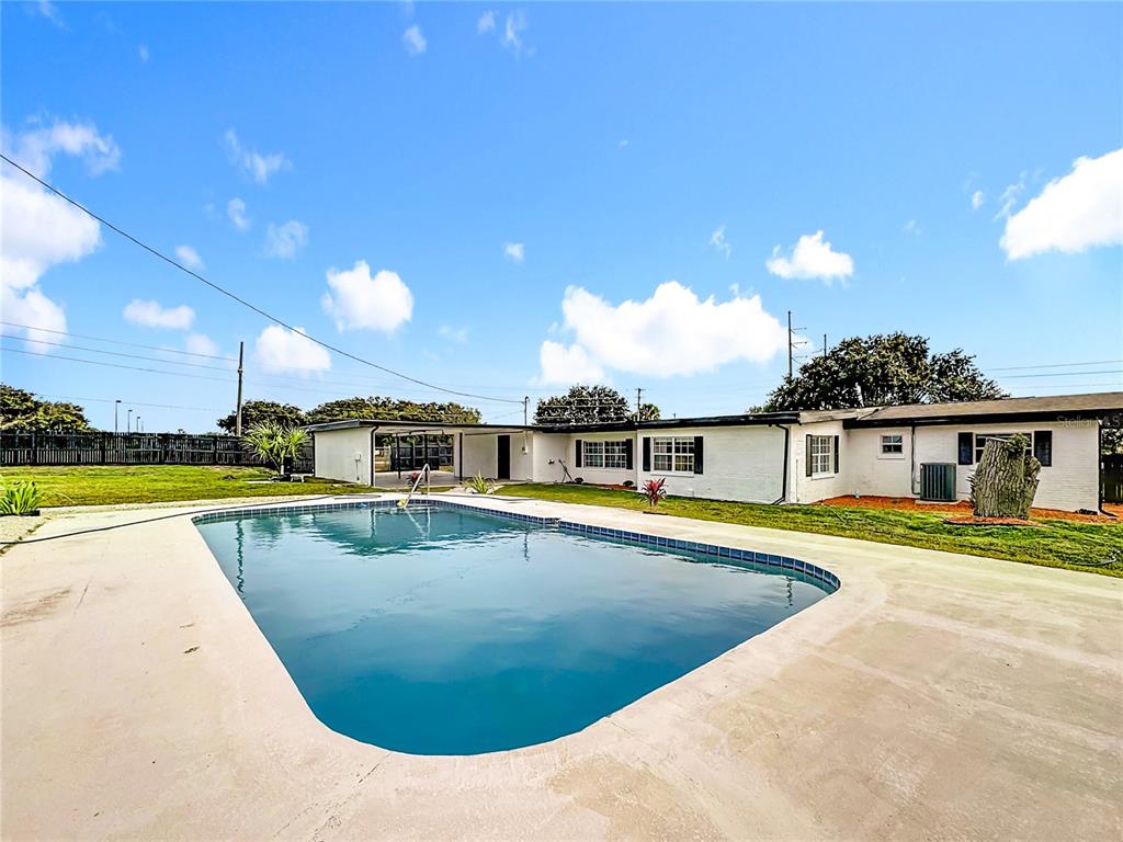 1890 Tyner Road Haines City, FL 33844 - Photo 44 of 48 a view of a swimming pool with a lounge chair