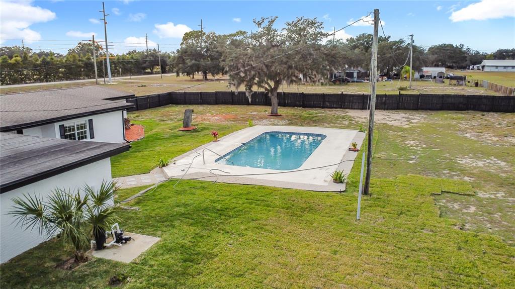 1890 Tyner Road Haines City, FL 33844 - Photo 46 of 48 a view of a swimming pool with a yard