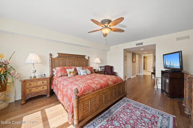 a bed room with a bed and a television