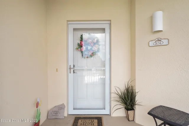 a view of a hallway with paintings on the wall