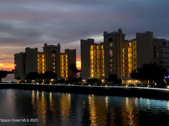 a view of a balcony with chair and wooden floor