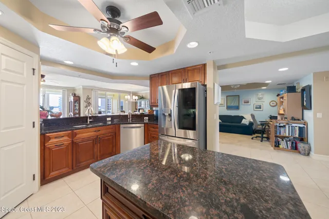 a large kitchen with stainless steel appliances lots of counter top space