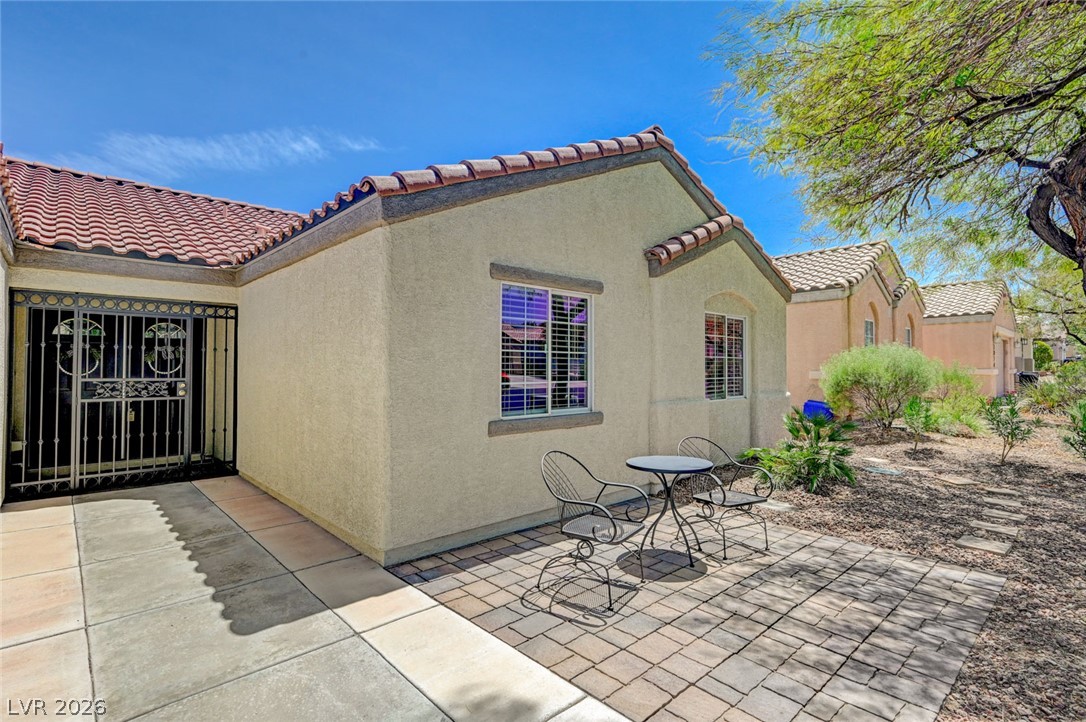 1072 Reed Point Court Henderson, NV 89002 - Photo 4 of 60 A private entry courtyard leads to this charming desert dwelling with a paved patio area.