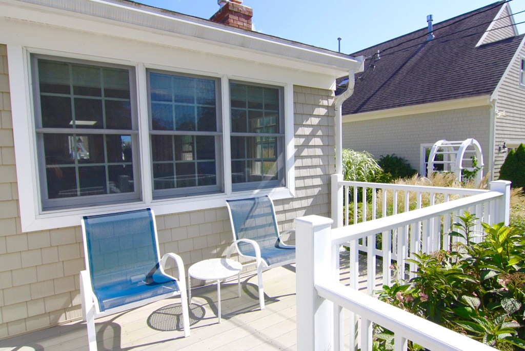 48 Bearse Road Mashpee, MA 02649 - Photo 6 of 42 a view of a chair and table in the balcony