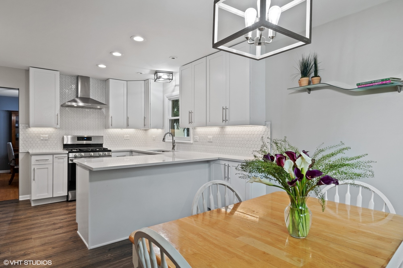 1715 Sequoia Trail Glenview, IL 60025 - Photo 2 of 29 a kitchen with stainless steel appliances kitchen island hardwood floor sink and stove