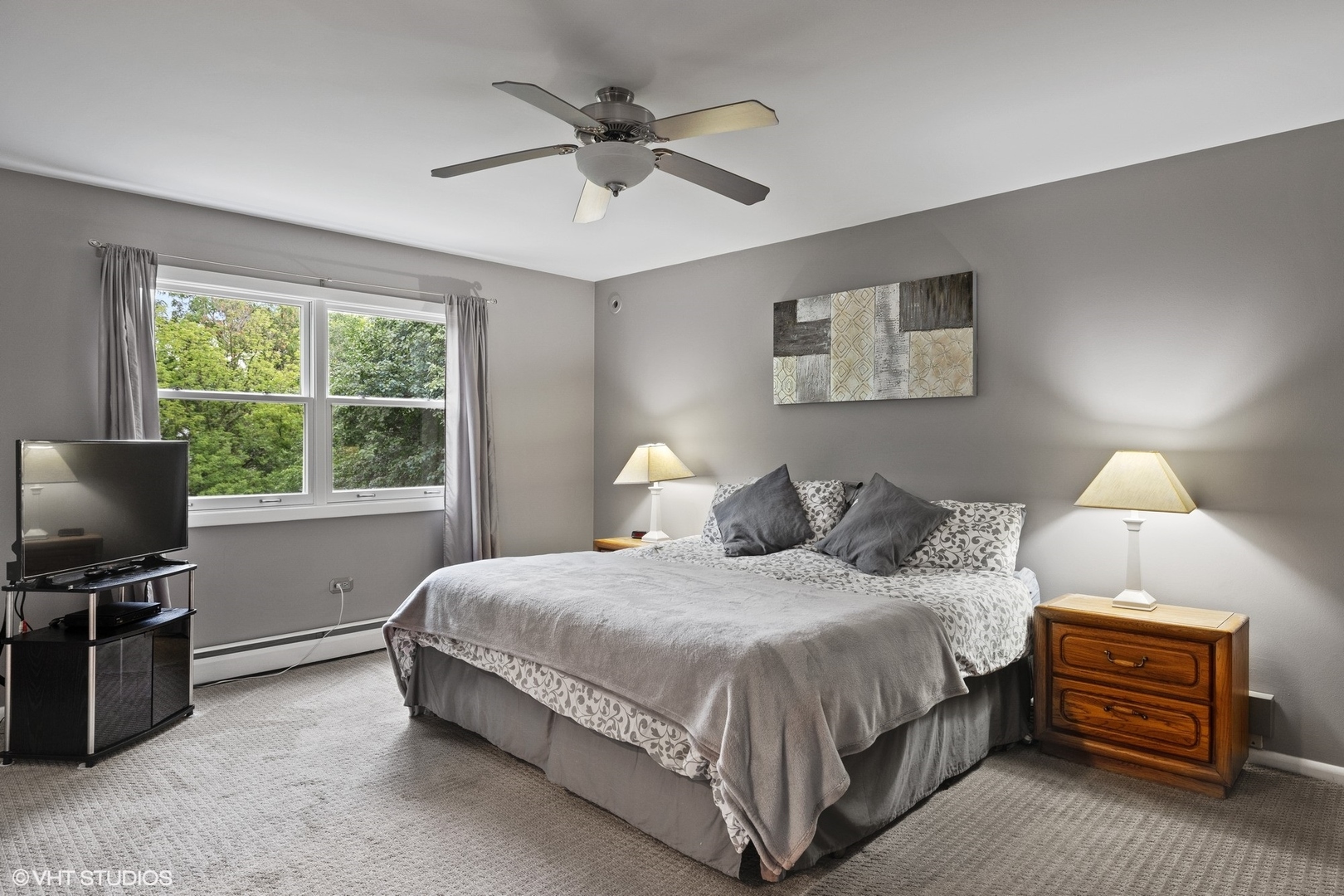 1715 Sequoia Trail Glenview, IL 60025 - Photo 15 of 29 a bedroom with a bed and a tv on the dresser