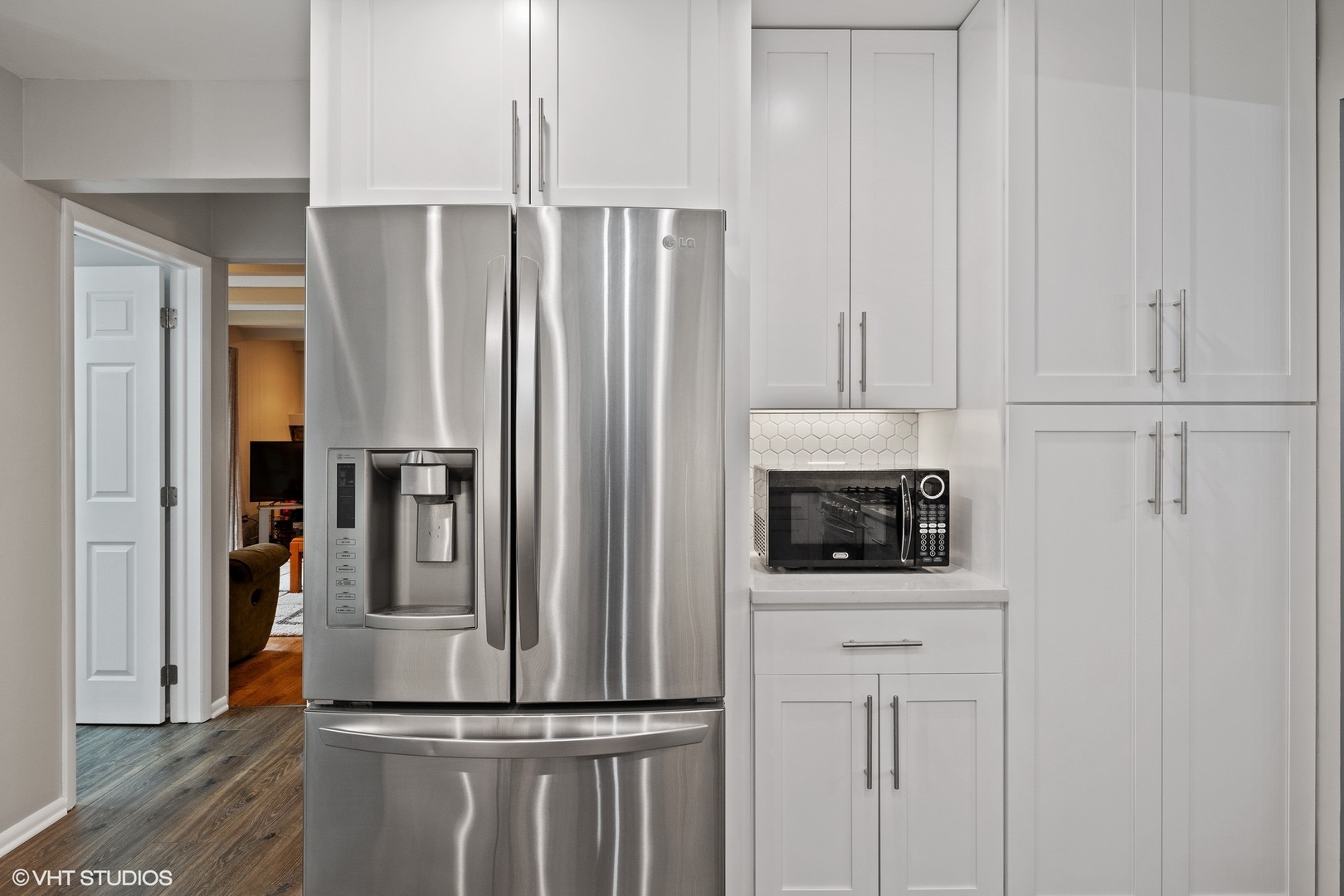 1715 Sequoia Trail Glenview, IL 60025 - Photo 4 of 29 a kitchen with white cabinets and stainless steel appliances